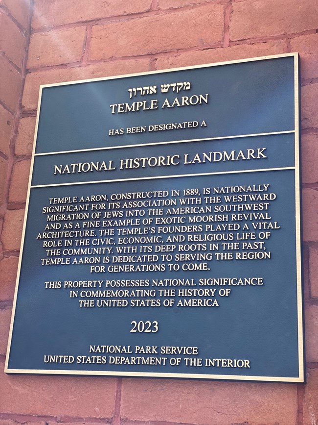 View of bronze plaque describing Temple Aaron's national significance and National Historic Landmark designation