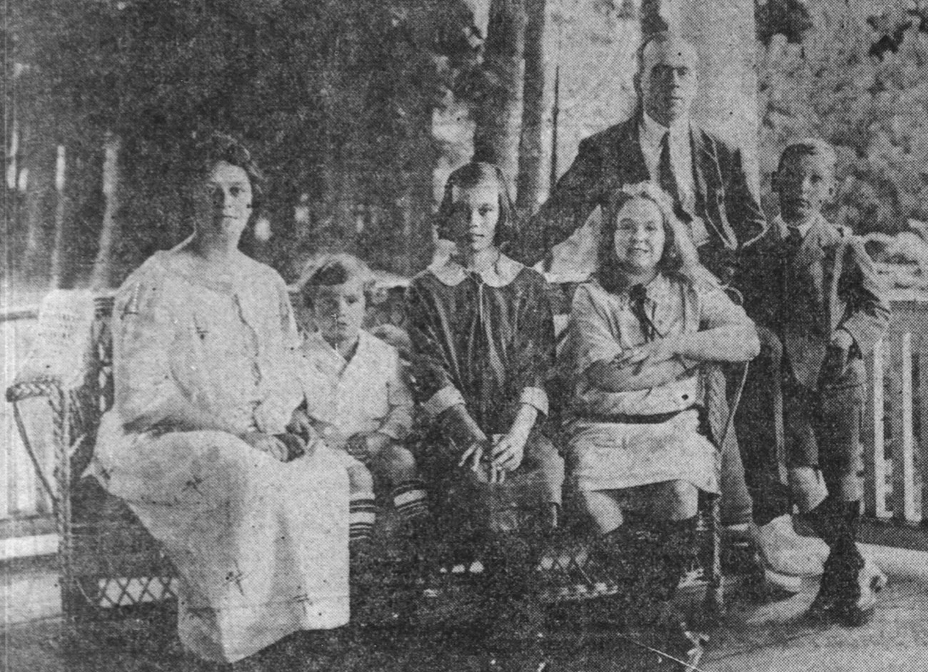 Parents and four children pose for a photograph