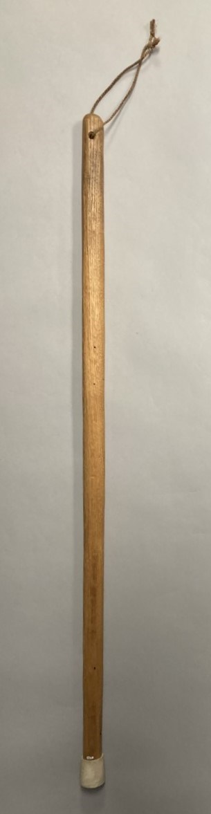 Wooden walking stick with string tie and rubber end