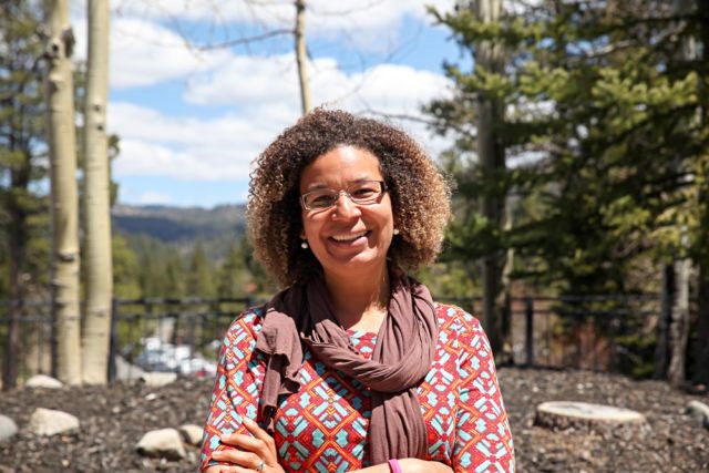 Corita Waters closeup of woman standing in forest
