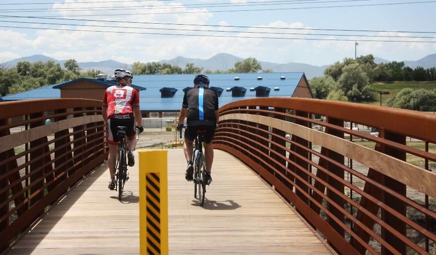 Bicyclists riding the newly constructed section of the Jordan River Parkway within West Jordan City. National Park Service photo.