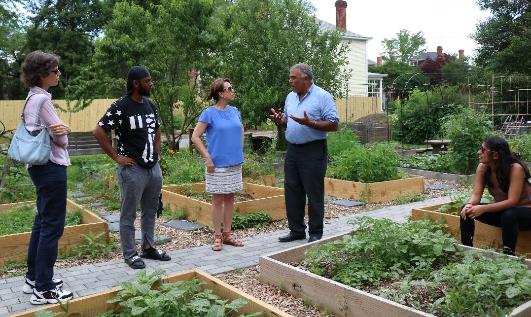 Rob Jones, the executive director of Groundwork Richmond, Virginia explains the role of the Trust in the McDonough Community Garden. Photo courtesy of Evelyn Moreno, National Park Service. Rob Jones, the executive director of Groundwork Richmond, Virginia explains the role of the Trust in the McDonough Community Garden. Photo courtesy of Evelyn Moreno, National Park Service.