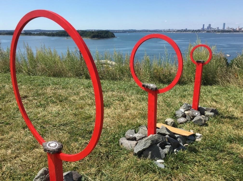 One of the two “Harboring Project” sculptures is a line of three freestanding red rings of different sizes. National Park Service photo.