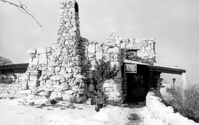Lookout Studio Stone building on the canyon's rim. On the left, there is a large chimney attached.