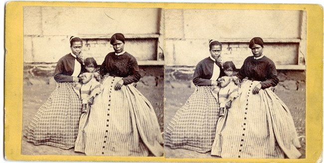 Stereoview of Selina Gray, enslaved servant at Arlington House, and two of her daughters.