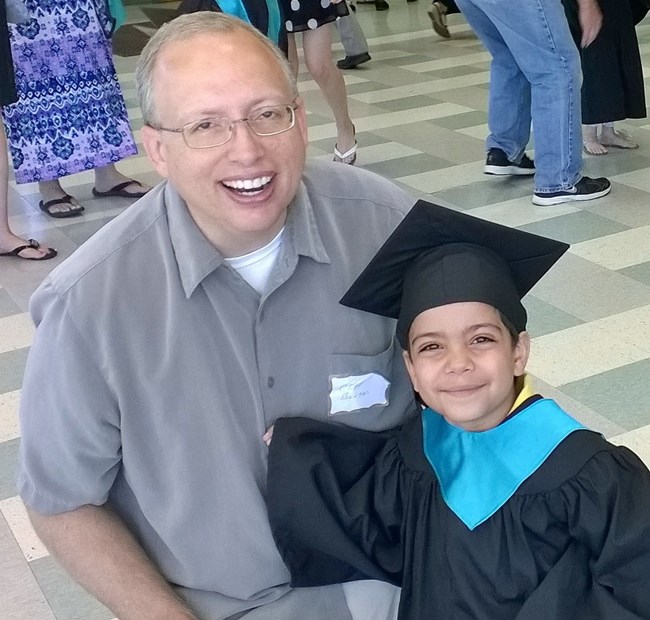 Cliff at his son's kindergarten graduation