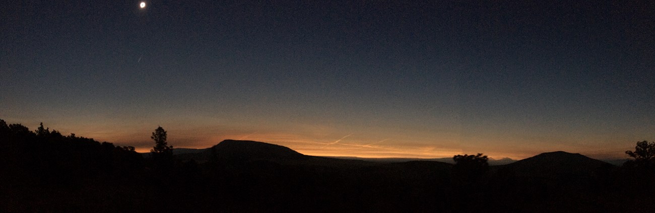 Panorama shows sunset effect during the eclipse at Crooked River National Grassland.