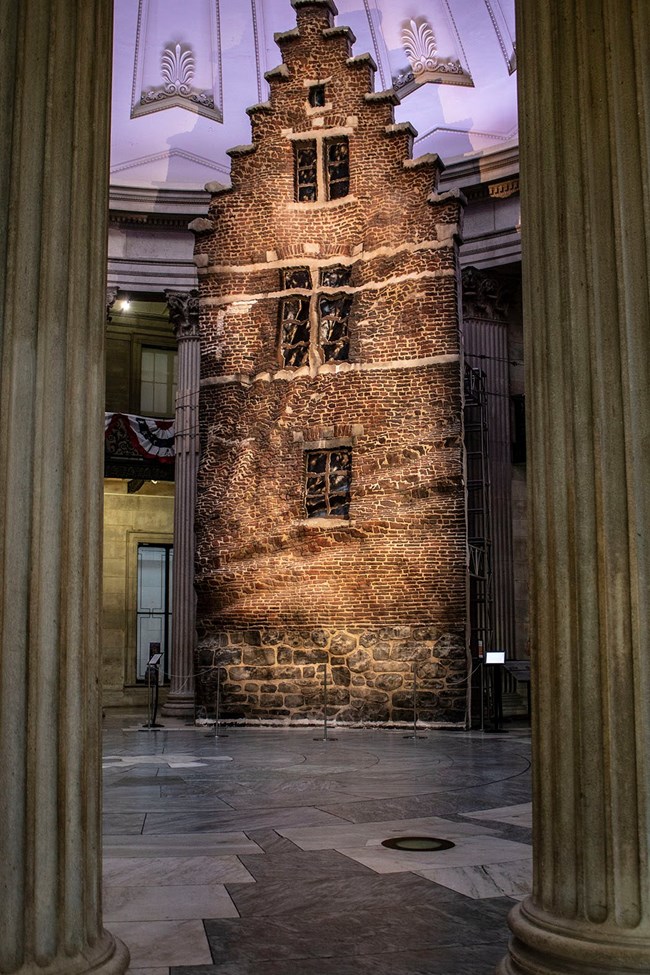 A 40-foot tall sculpture stands in Federal Hall's pavilion.