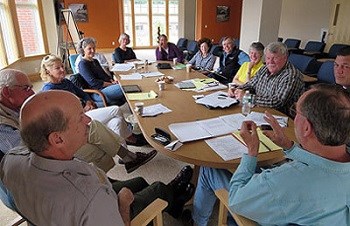 Group of people at a table having a discussion