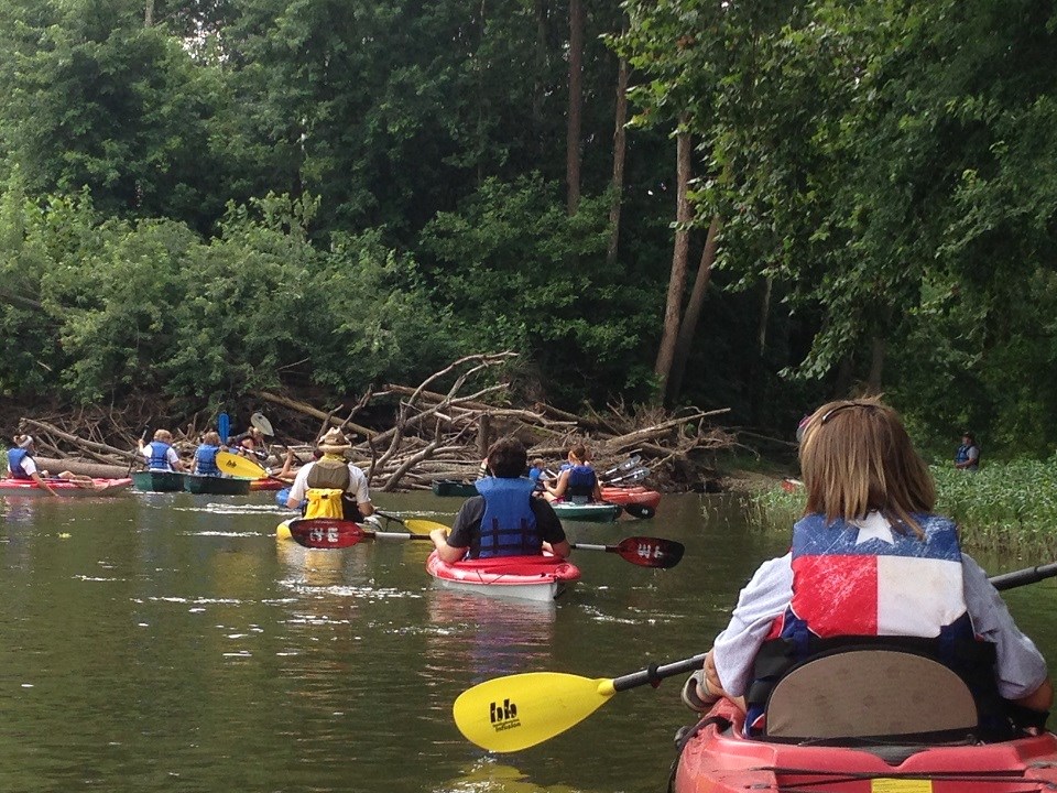 Group in kayaks on a river