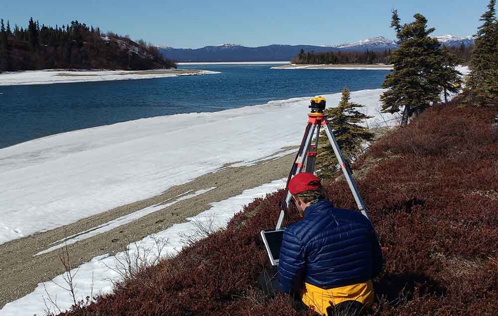 IMG_20170414_160657780_web A researcher uses survey equipment along the lake edge.