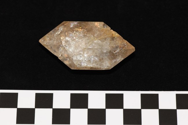 A pentagon-shaped crystal object.