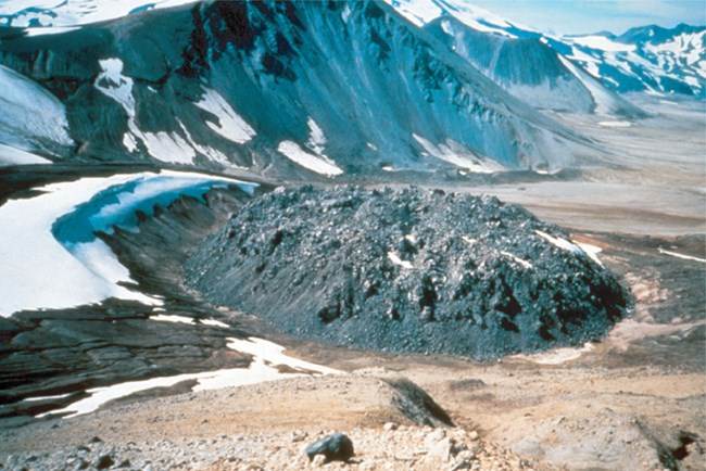 a dome of blocky rock in mountainous area