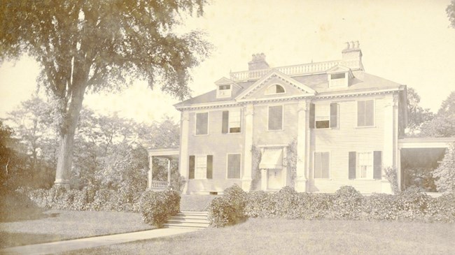 Old photo of the exterior of Longfellow House. NPS photo