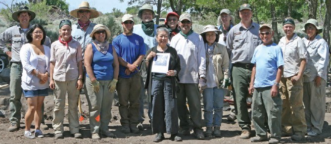 An excavation crew smiles at you