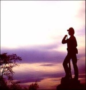 Union soldier statue with sunset background