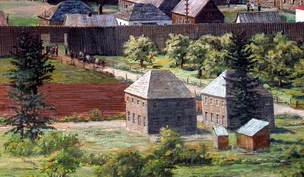 A close up of a painting showing two two-story wooden buildings built side by side. To the south of the buildings is the Fort Vancouver stockade and an entrance into it.