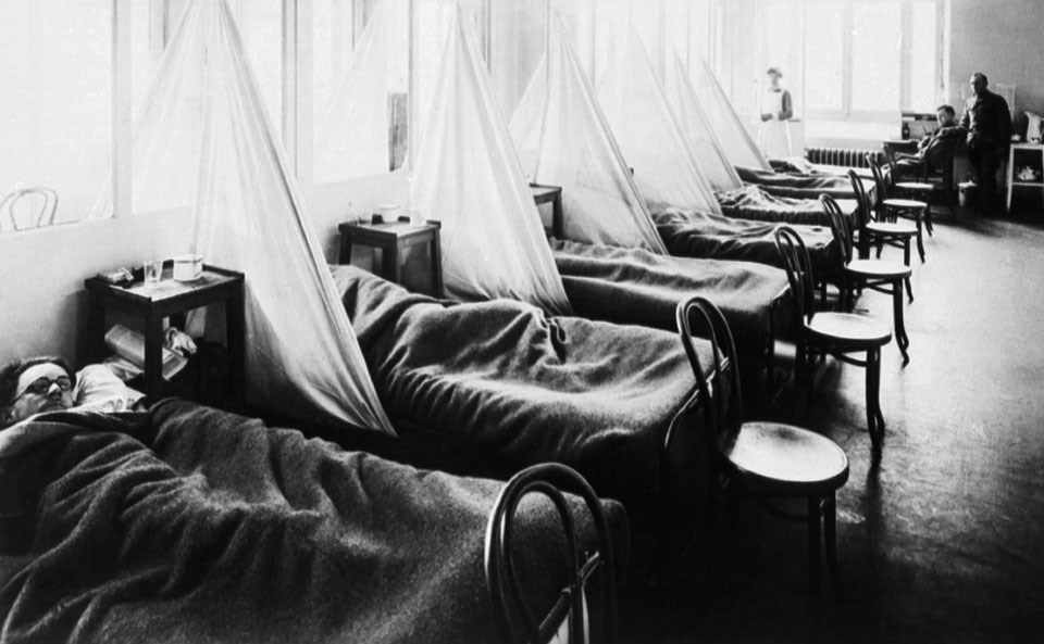 US Army Hospital in France Six beds filled with men stricken with the flu and single chairs at the end of their beds