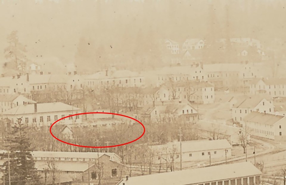 Close up of a an aerial photo of Vancouver Barracks with a building circled in red.