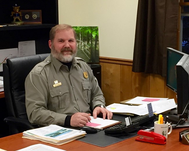 Matthew Carroll seated at desk