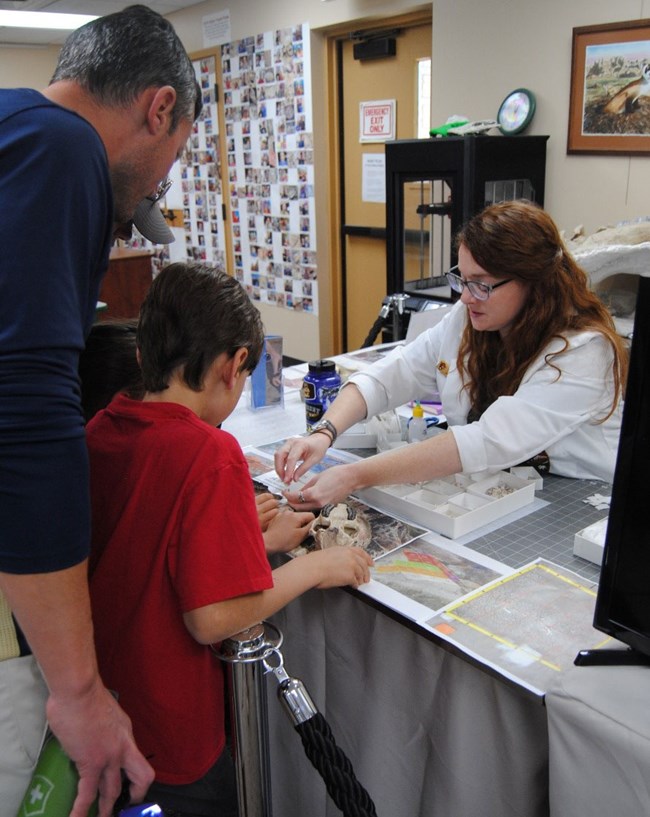 GIP Bret Buskirk working with fossils while talking to visitors