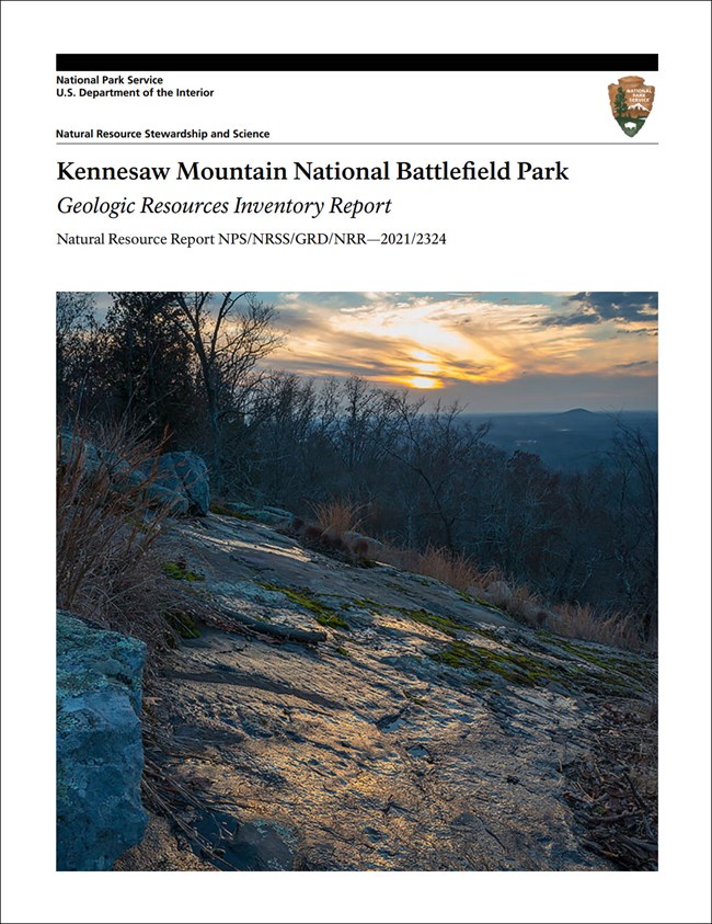 Report cover with photo of a rock outcrop.
