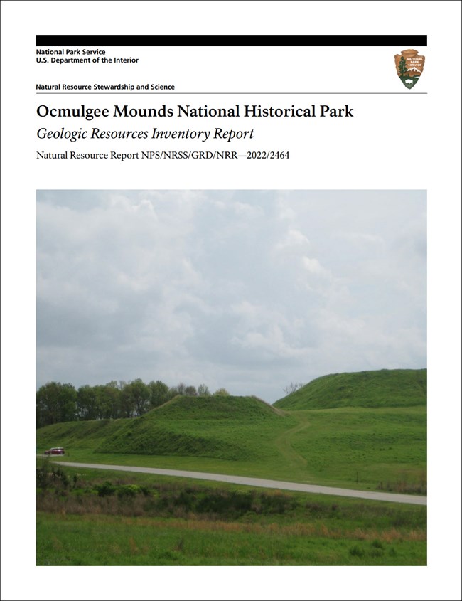 Report cover with photo of grass covered mounds