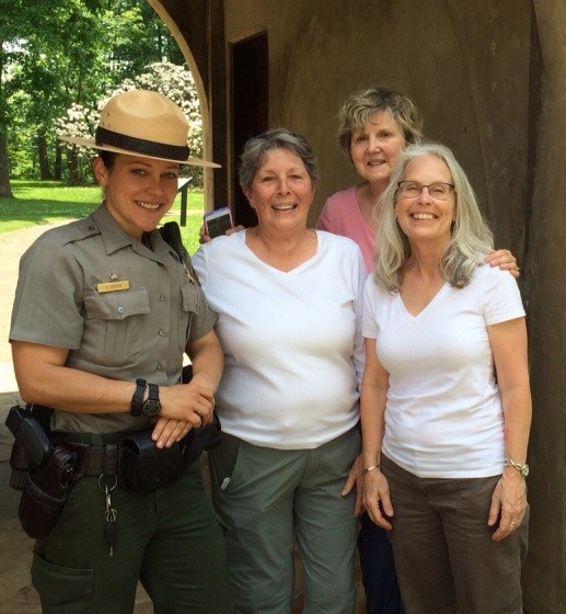 A NPS ranger standing with the volunteers of the Monarch Mafia