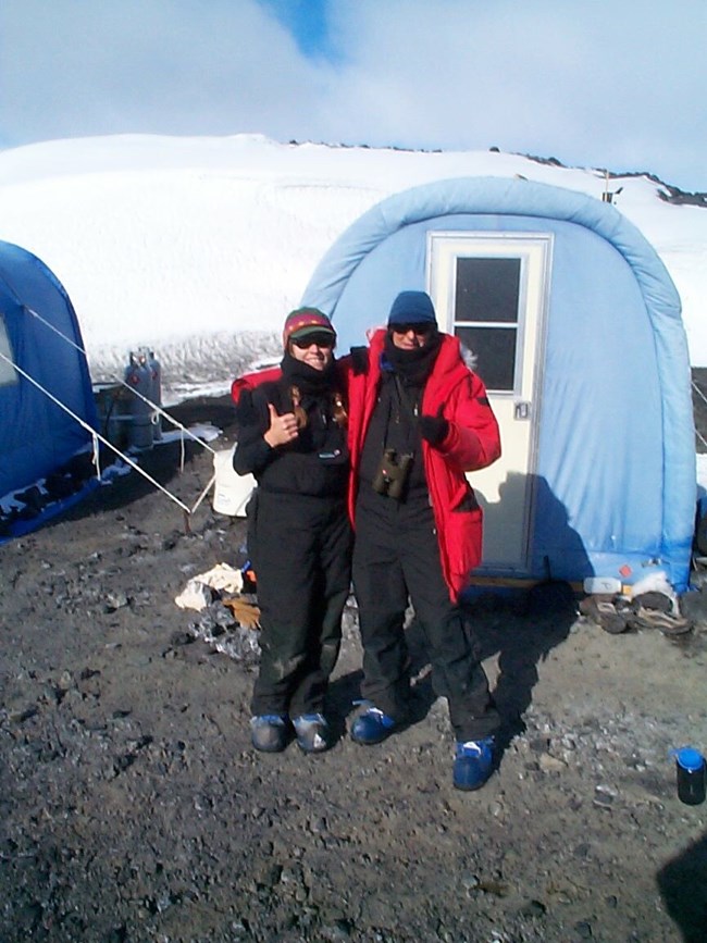 Dr. Allen and a colleague outside a tent in Antarctica.