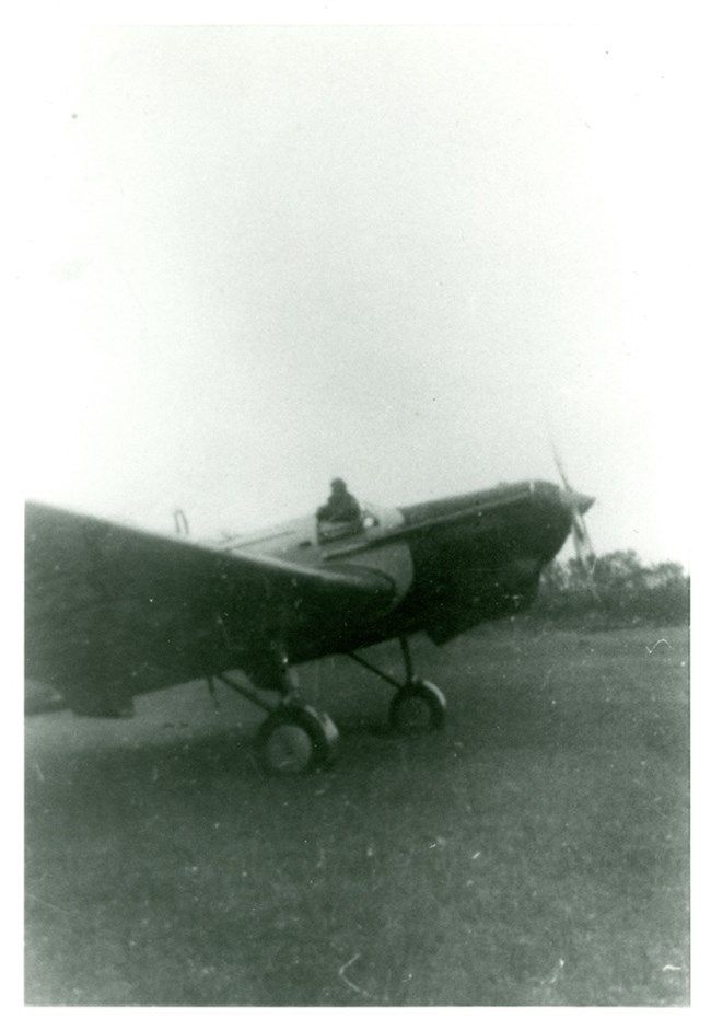 Photo of ANT-25 with figure of Chkalov rising out of cockpit