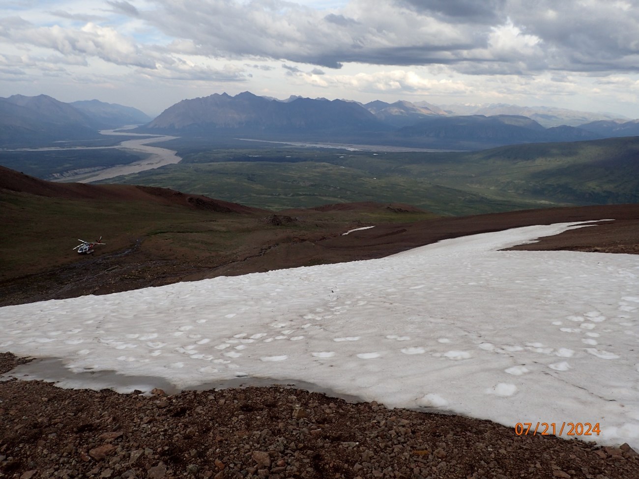A snow patch along a rocky mountain slope, in a photo dated 07/21/2024. A snow patch along a rocky mountain slope, in a photo dated 07/21/2024.