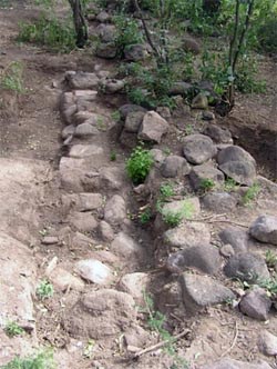 Excavated stone footing.