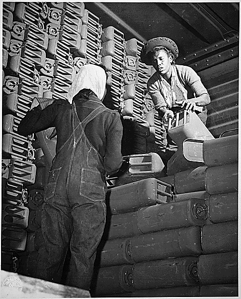 Two African American women working at the Savannah Quartermaster Depot, 1943 black and white photo of two African American women doing industrial work