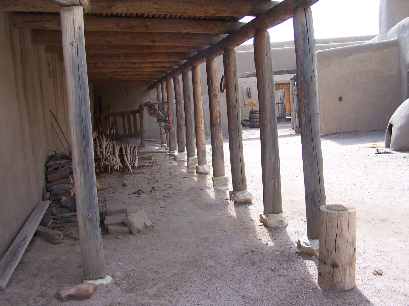 An enclosed corral defined by adobe walls