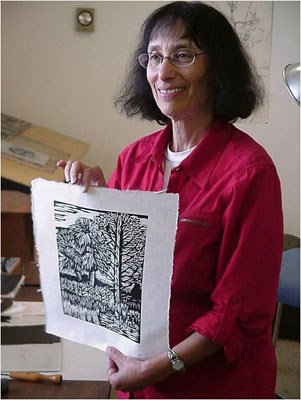 Artist-in-Residence Molly Doctrow demonstrates her wood cut ink print art.