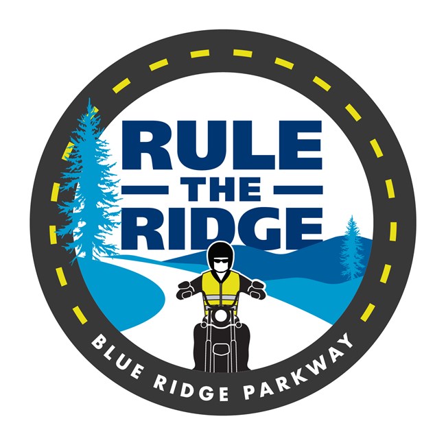 Circular logo of person wearing a yellow vest riding motorcycle with trees and mountains in the background.