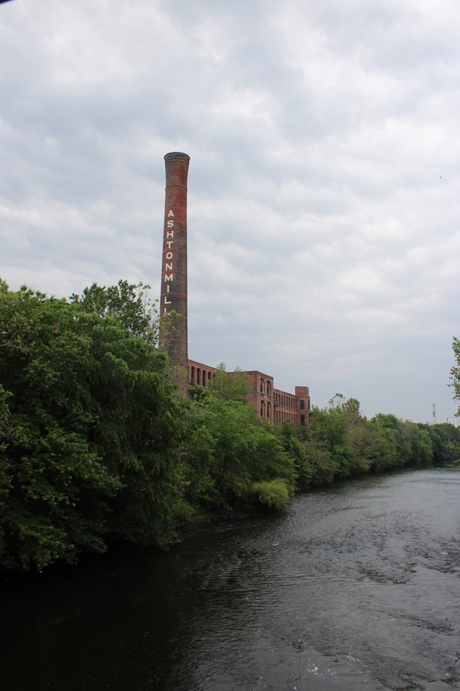 The Blackstone River with a mill in the background