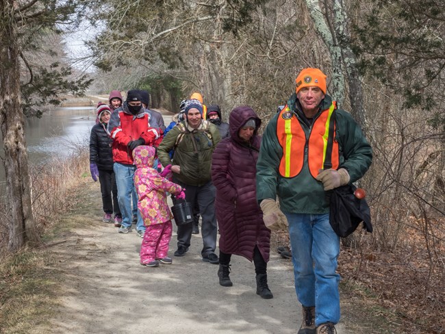 Volunteer leading group on walk