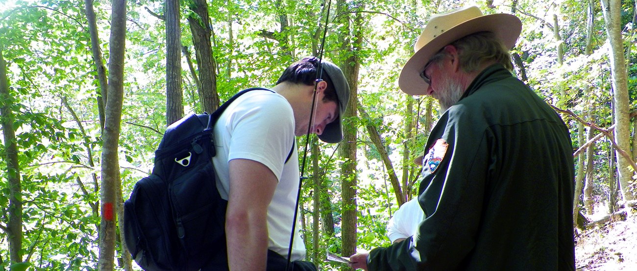 Ranger Richard talks with a fisherman along the Turnpike Trail