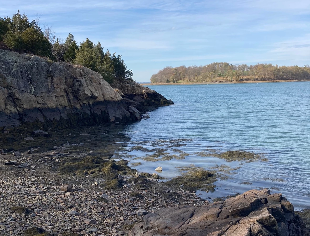 Worlds-End-Coastline a rocky shoreline with an island in the distance