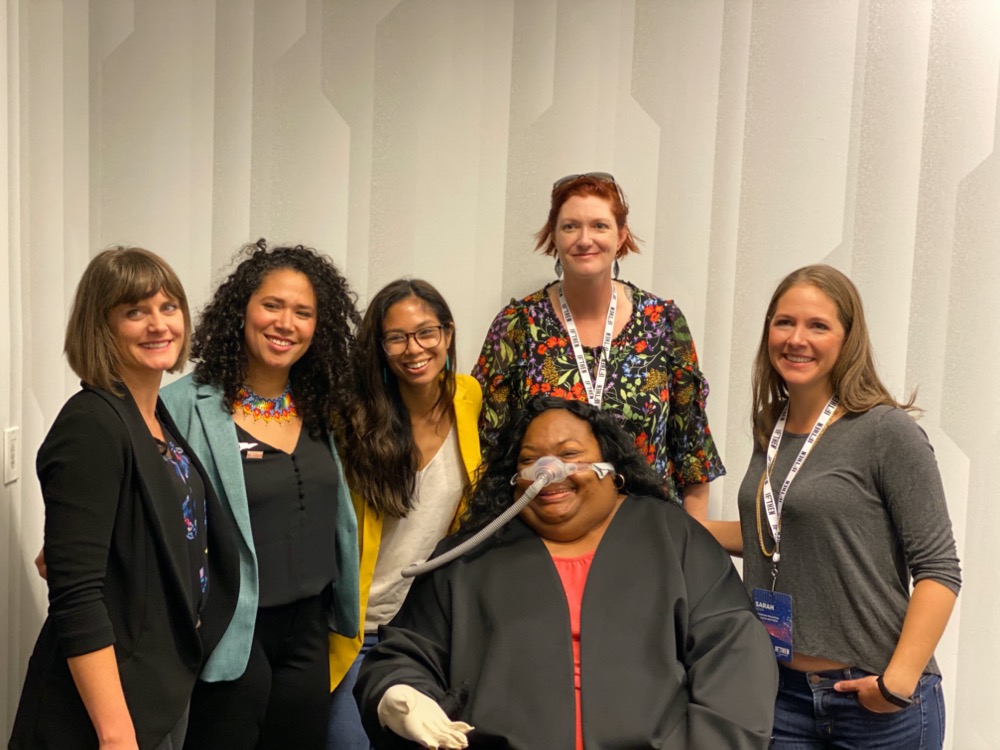 Six of the 125 female AAAS IF/THEN® Ambassadors pose for a picture, which highlights the diversity in the group. Scientist, science educator, and CNMF Outreach Coordinator Samantha Wynns stands tall in the back.
