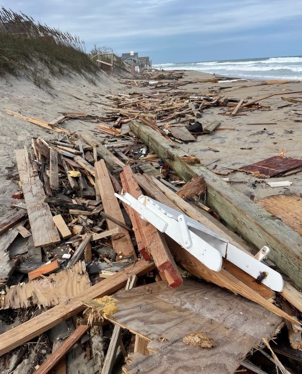 Collection of house debris on the beach.