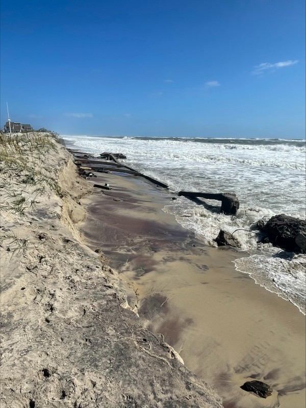 Photo showing exposed infrastructure along the beach.