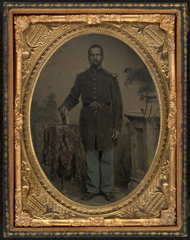 Portrait of William Wright, 114th USCI, holding a book.