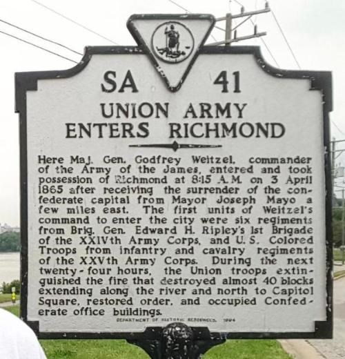 Historic marker sign filled with text