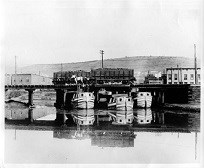 Black & white image of Canal barges waiting to be filled with coal from the mines of Western Maryland, West Virginia, and South Western Pennsylvania.