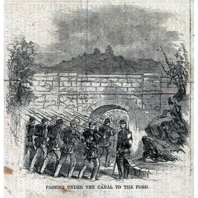 Illustration shows troops passing under the Canal at Hancock.