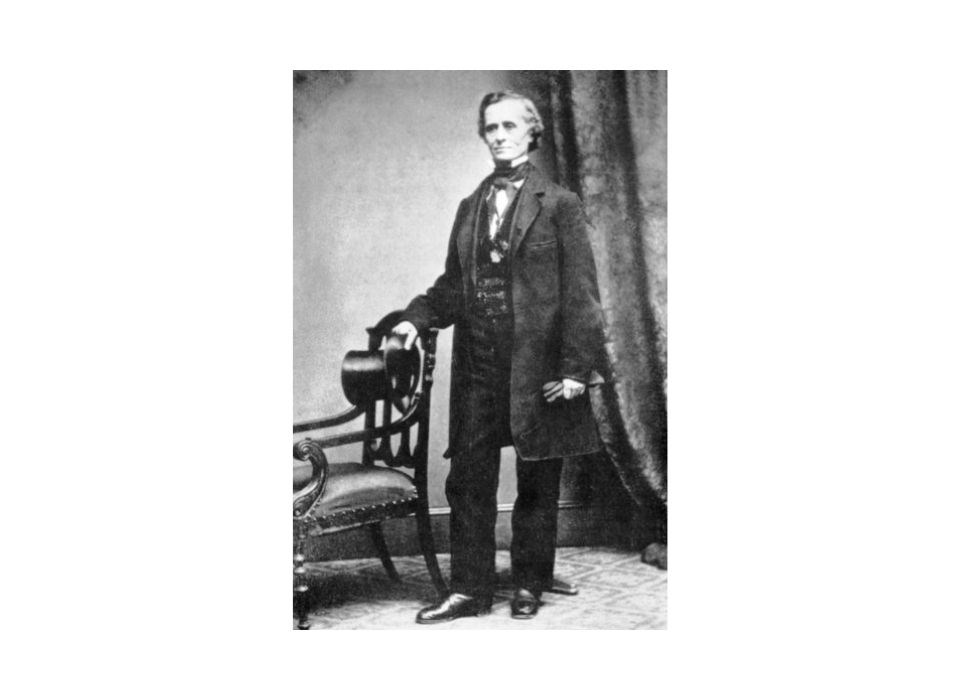 Historical black and white image of a standing Dr. Grafton Tyler.