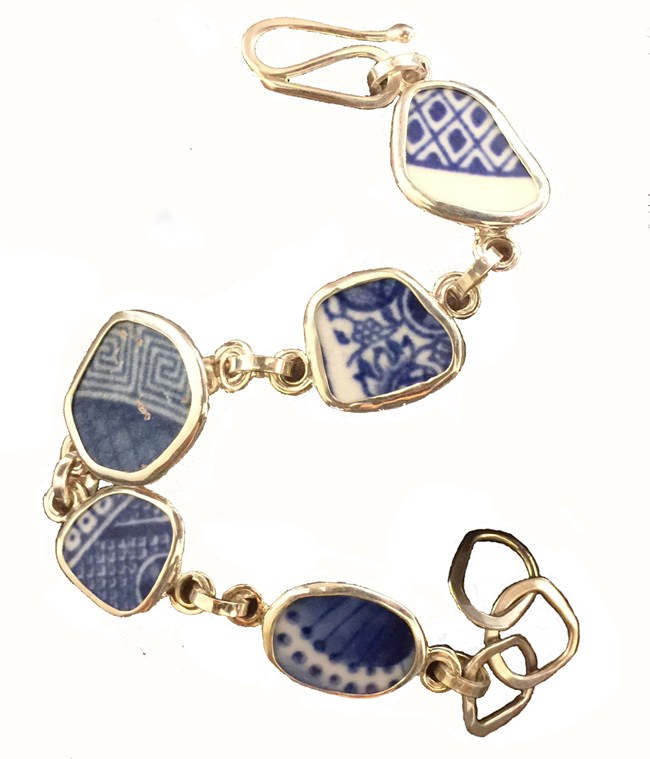 photograph of a bracelet made of pieces of blue and white changey