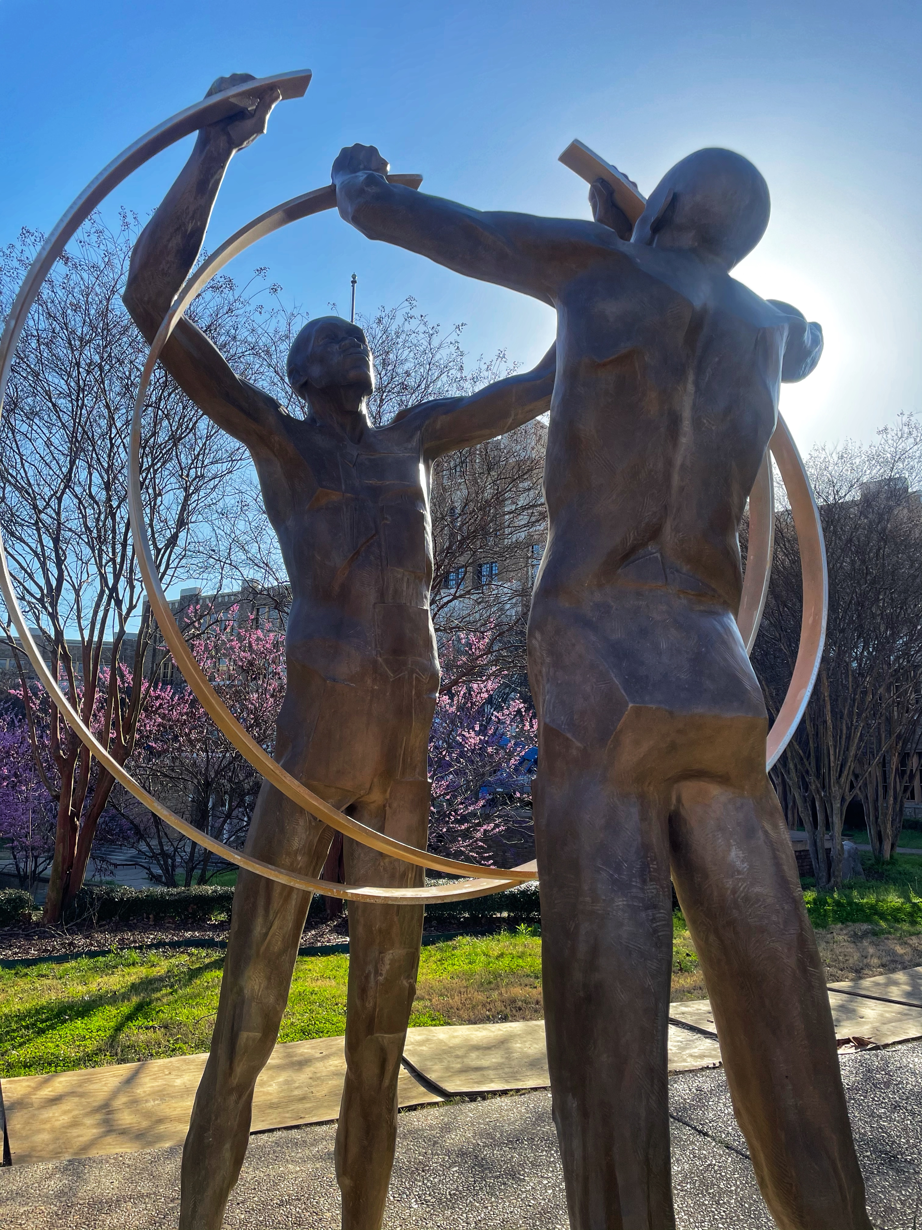 A statue on the grounds at Central High entitled "United" depicts two figures with raised arms holding rings that almost completely interlock - a symbolic reminder of the work still to be done to ensure educational equality.